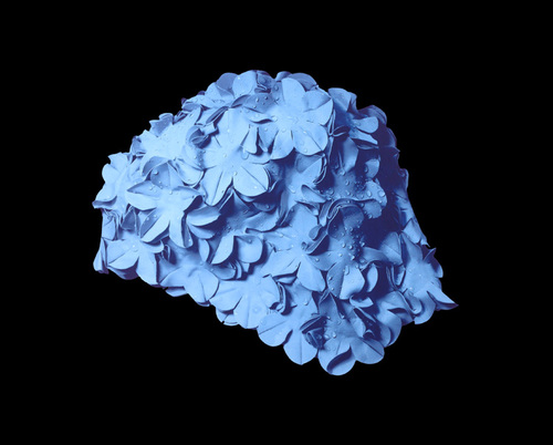 Blue cap on black background, 2015